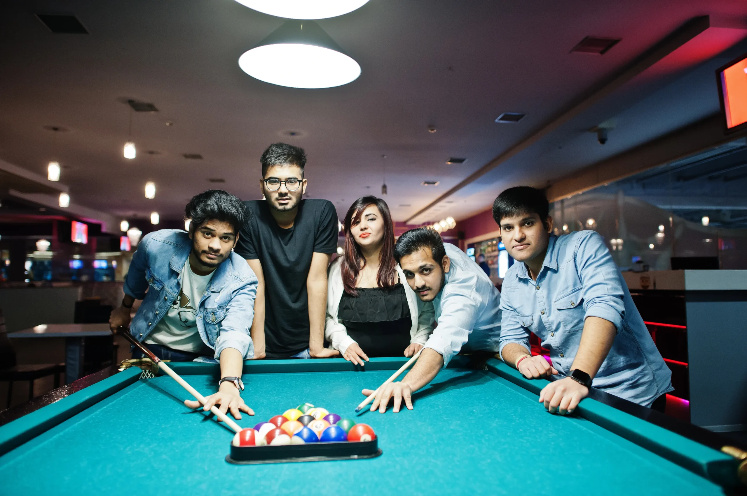 group-stylish-asian-friends-wear-jeans-playing-pool-billiard-bar
